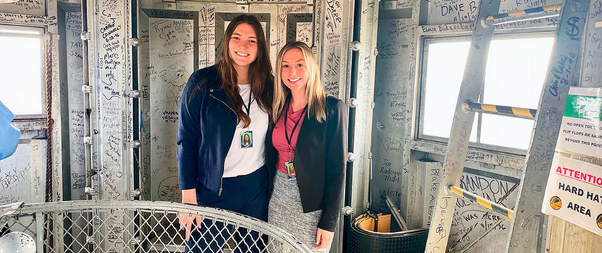 Two women smile inside Illinois Capitol dome